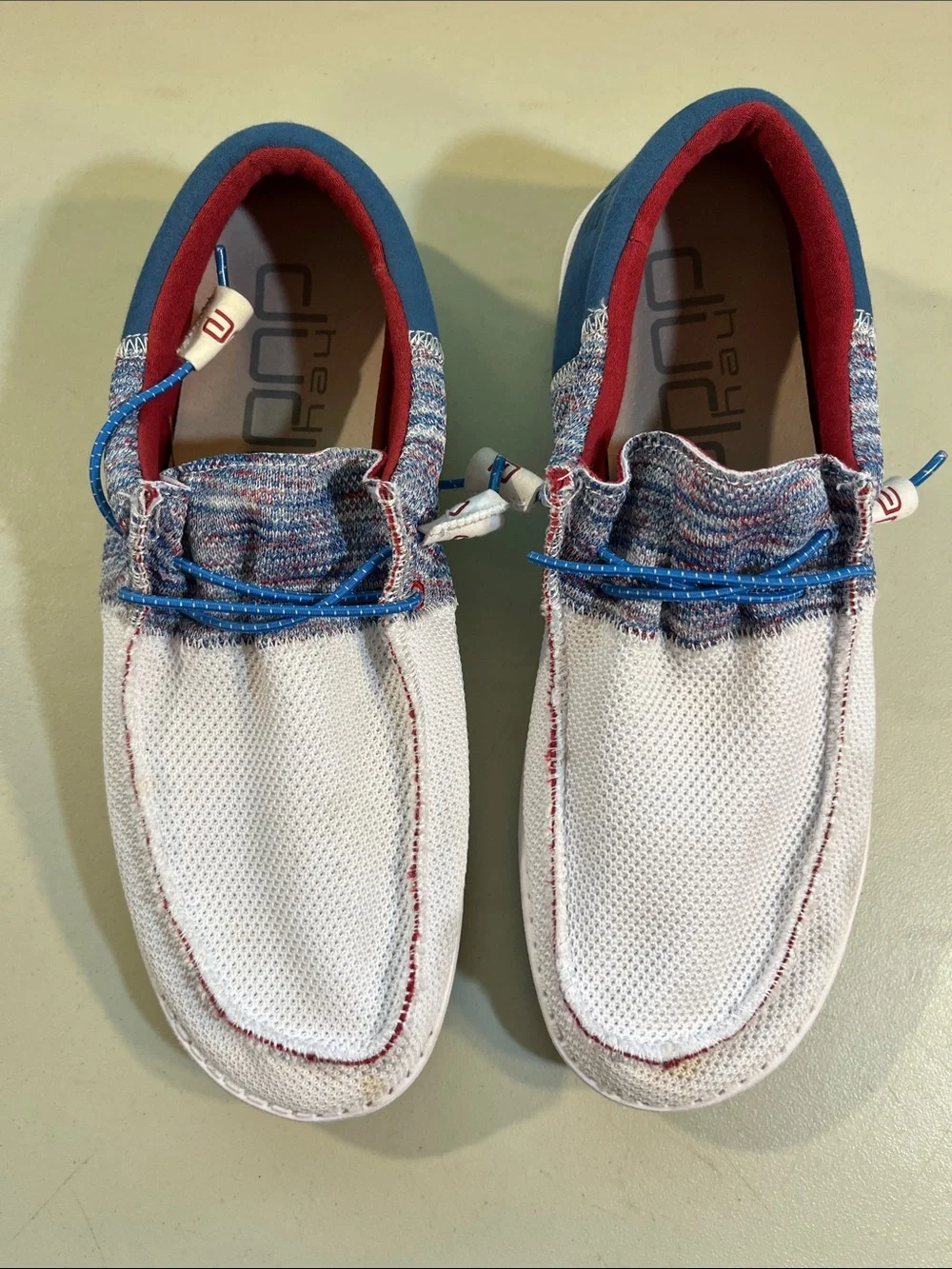 Hey Dude Men’s Slip-On Loafers in White with Blue and Red Accents